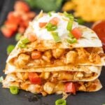 Chicken quesadillas with sour cream and cheese.