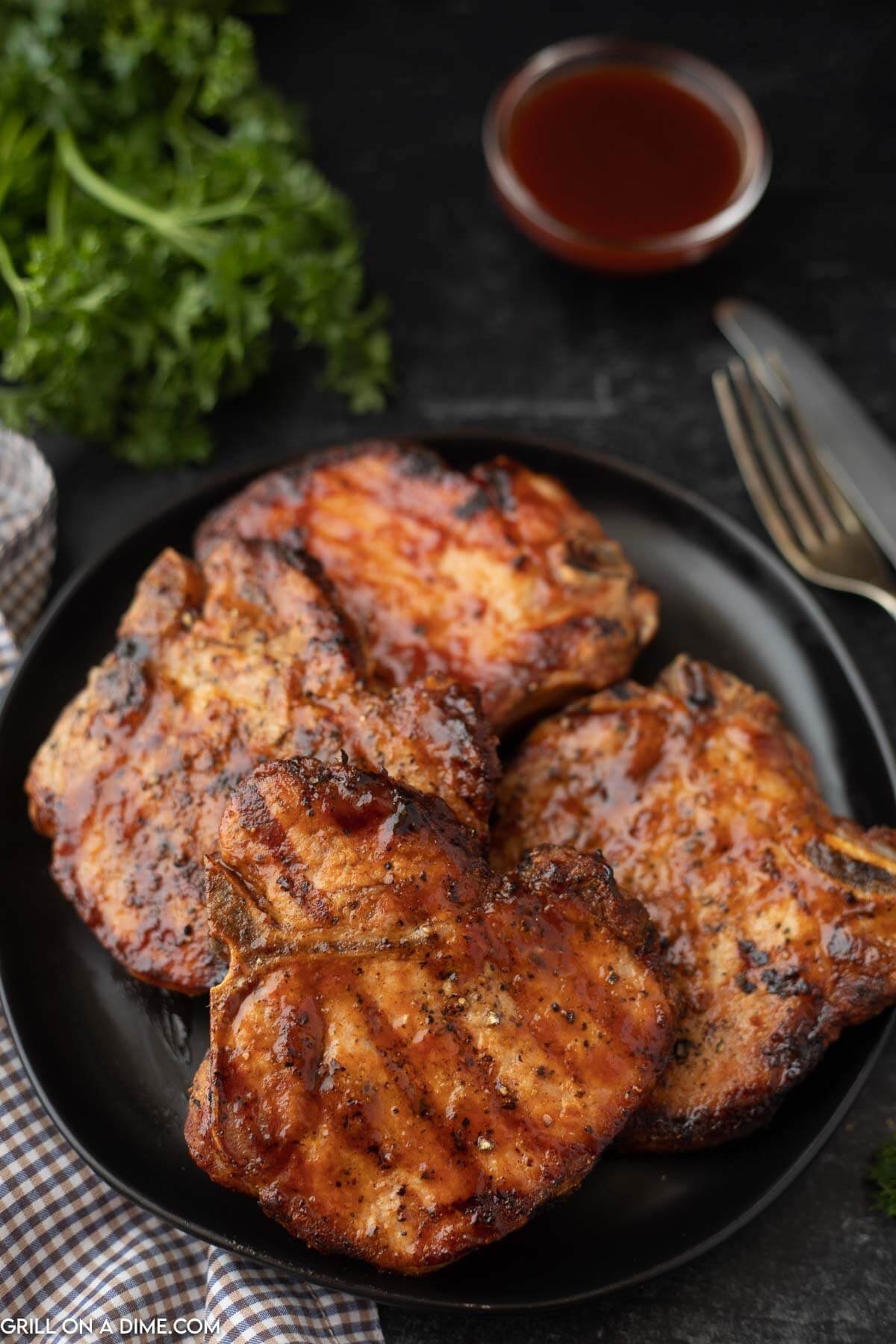 BBQ Pork Chops stacked on a plate