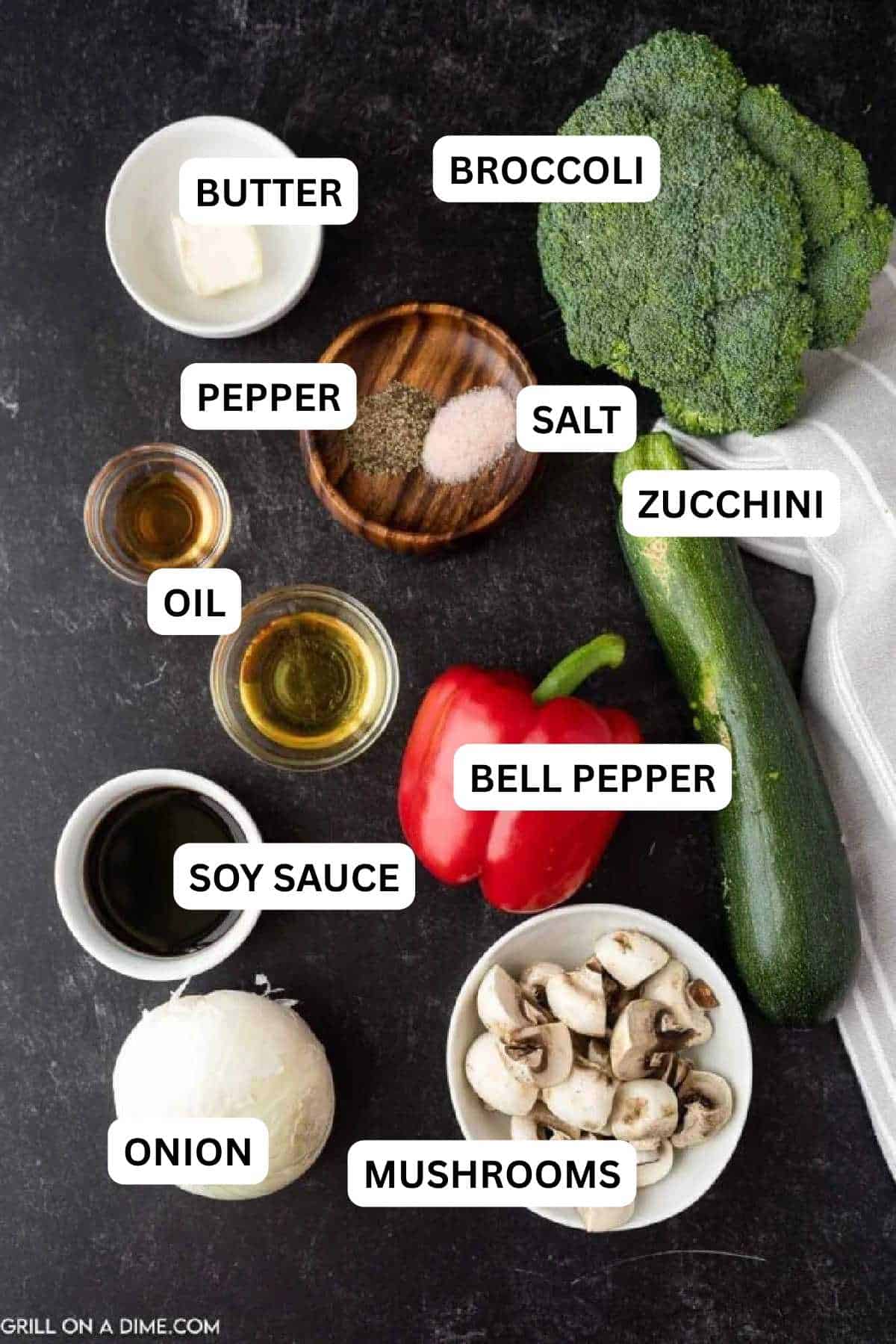 Ingredients needed to make this recipe which includes White onion, zucchini, mushrooms, broccoli, red bell pepper, butter, oil, soy sauce, pepper, and salt.