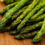 Fresh roasted asparagus spears with slightly charred tips. Perfect for healthy meals and side dishes.