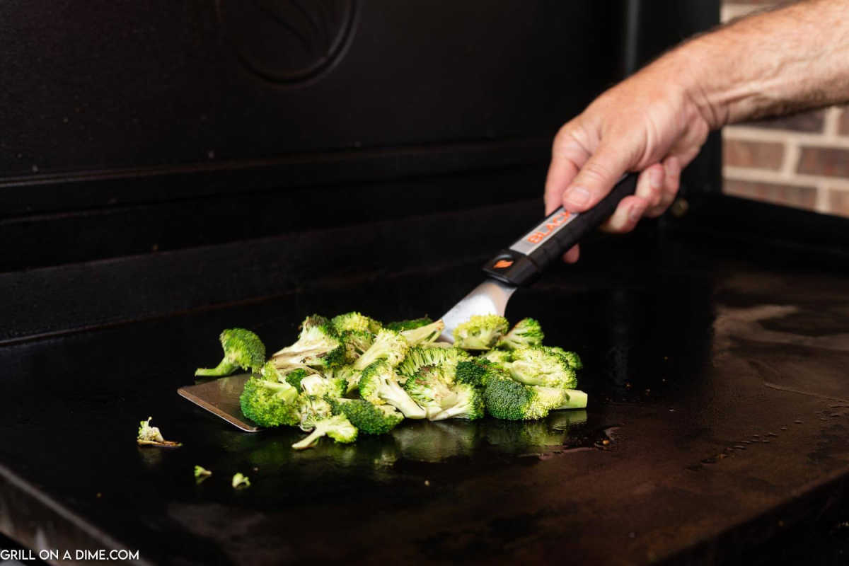 Cooking the broccoli on the griddle.