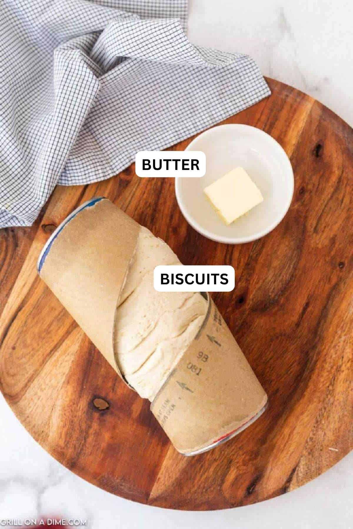 Ingredients needed to make this recipe which includes canned biscuits and butter.