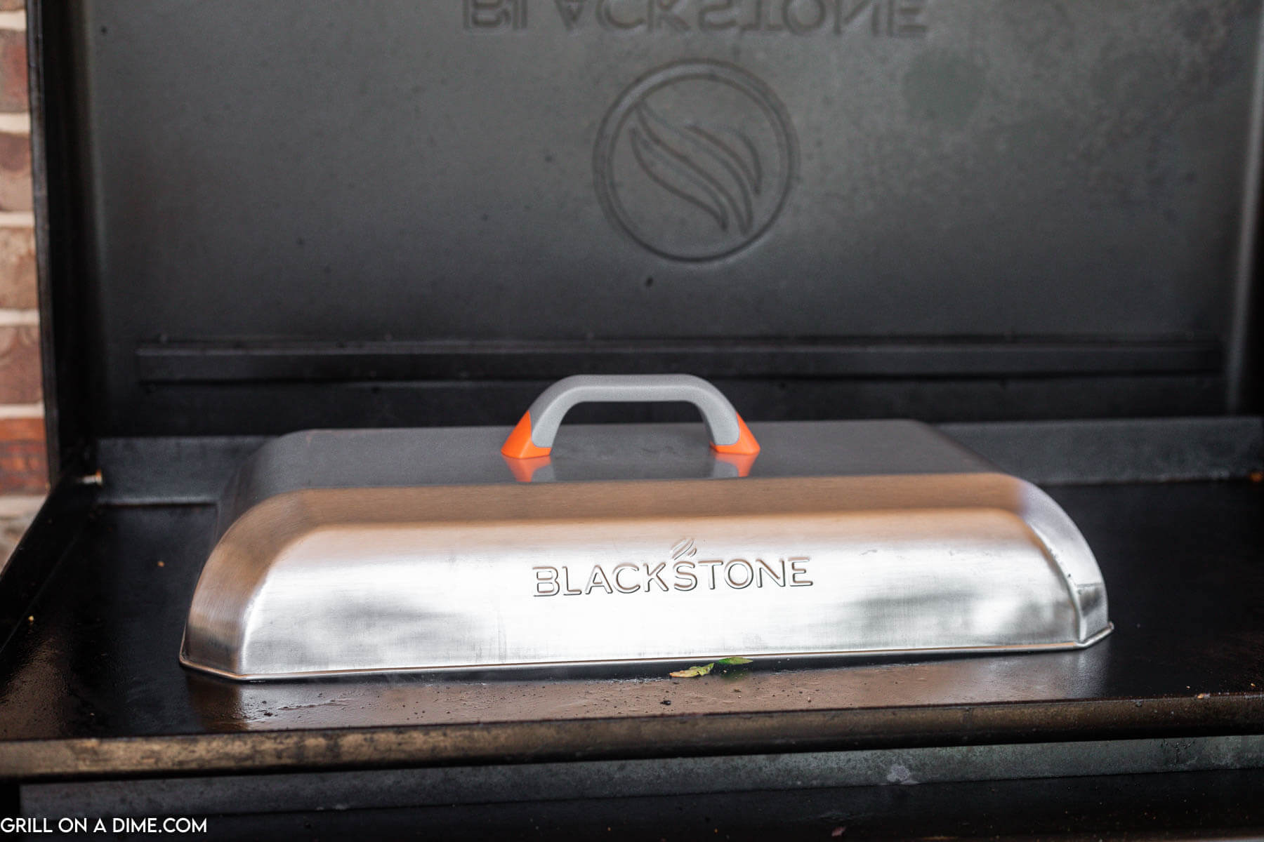 Cooking dome on a blackstone griddle.