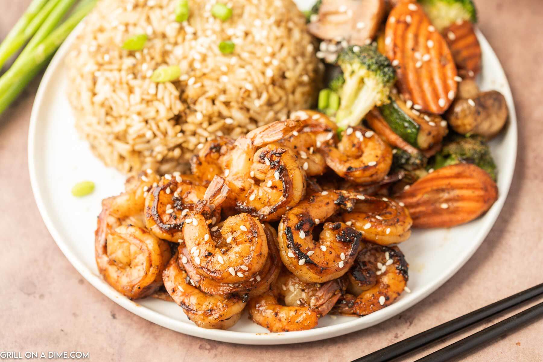 Hibachi Shrimp, veggies, and rice on a plate
