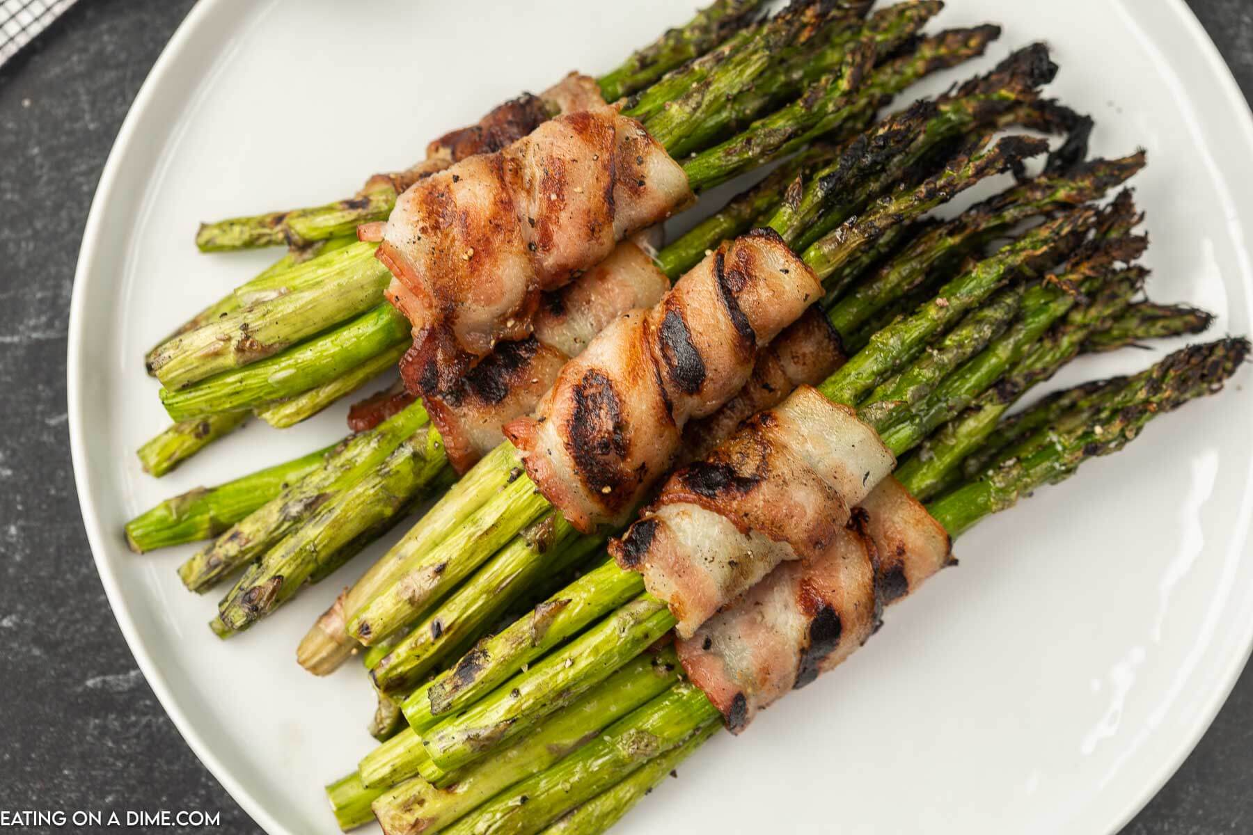Bacon wrapped asparagus on a plate