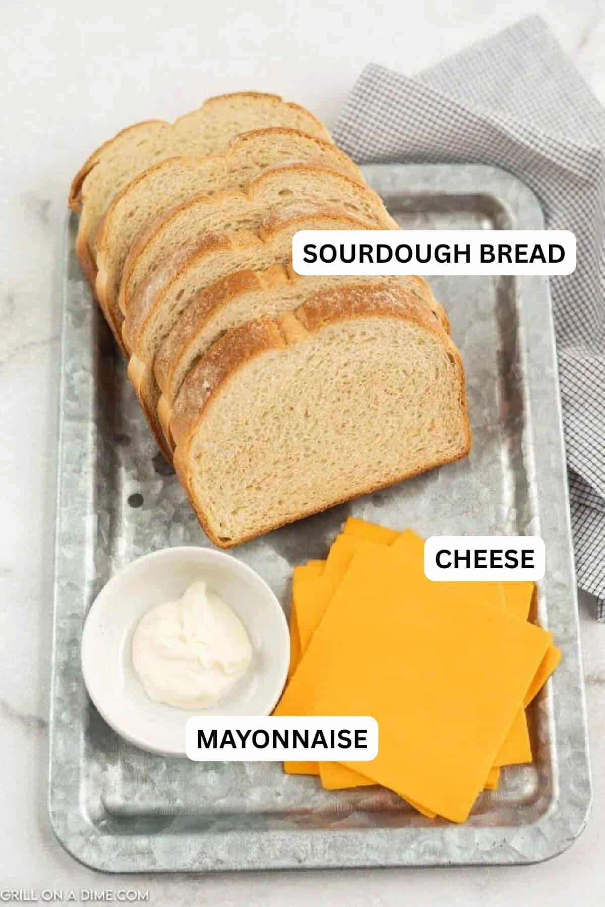 Ingredients needed for this recipe which include sourdough bread, slice cheese and mayonnaise.
