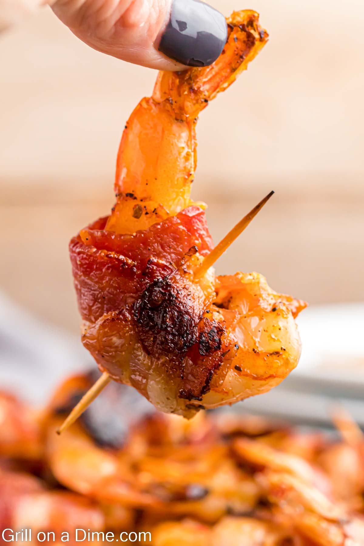 Grilled Bacon Wrapped Shrimp with a toothpick inserted