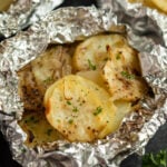Baked potatoes in foil packets.