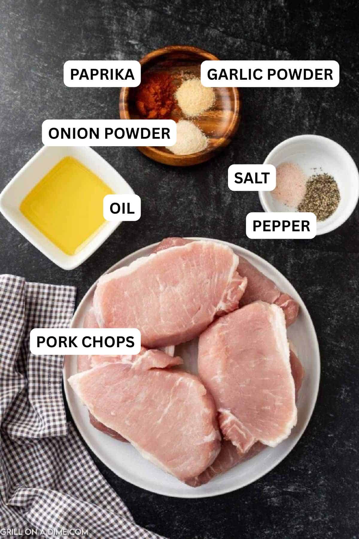 Ingredients to make this recipe which includes boneless pork chops, spices and oil. 