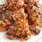 Chicken thighs with sesame seeds and sesame oil.