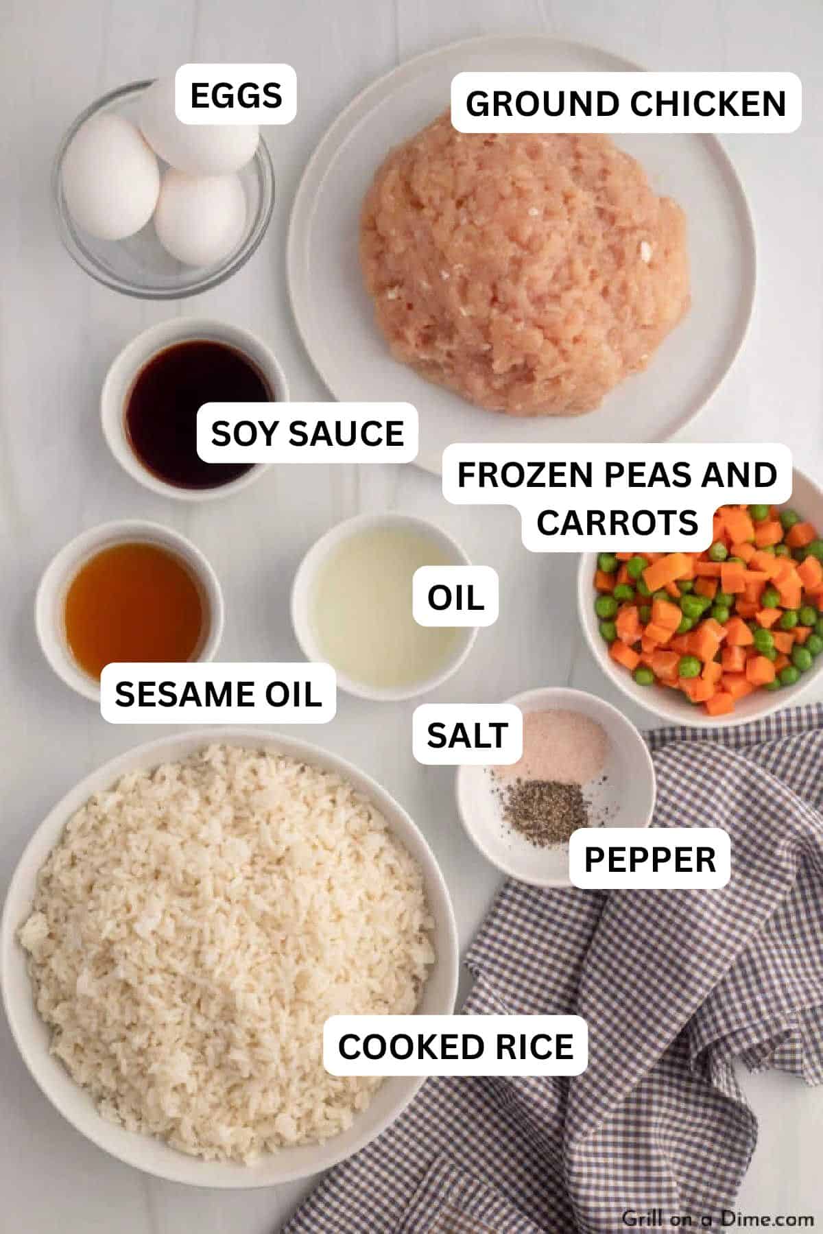 Ingredients needed for this recipe includes Ground Chicken, sesame oil, vegetable oil, frozen peas and carrots, eggs, cooked rice, soy sauce, salt, pepper, green onions.