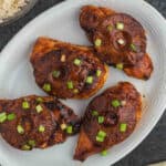 Hawaiian Chicken Breast on a platter topped with green onions.