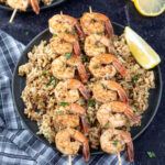 Grilled Shrimp Skewers on plate with rice