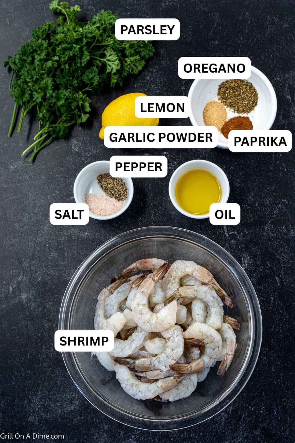 Ingredients needed - shrimp, olive oil, salt and pepper, lemon, oregano, garlic powder, paprika, parsley, lemon.