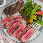 Slice Tuna Steaks on a plate with a green salad