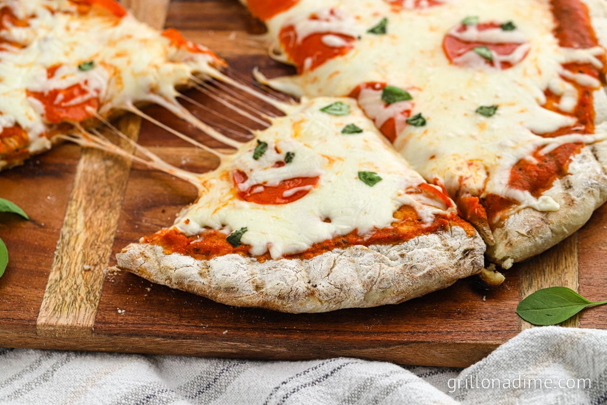 Homemade Pizza on a wooden cutting board