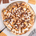 S'mores pizza with chocolate chips and marshmallows.