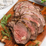 Slice prime rib on a cutting board