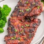 Grilled pork chops with broccoli and bbq sauce.