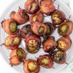 Bacon wrapped brussel sprouts on a white plate