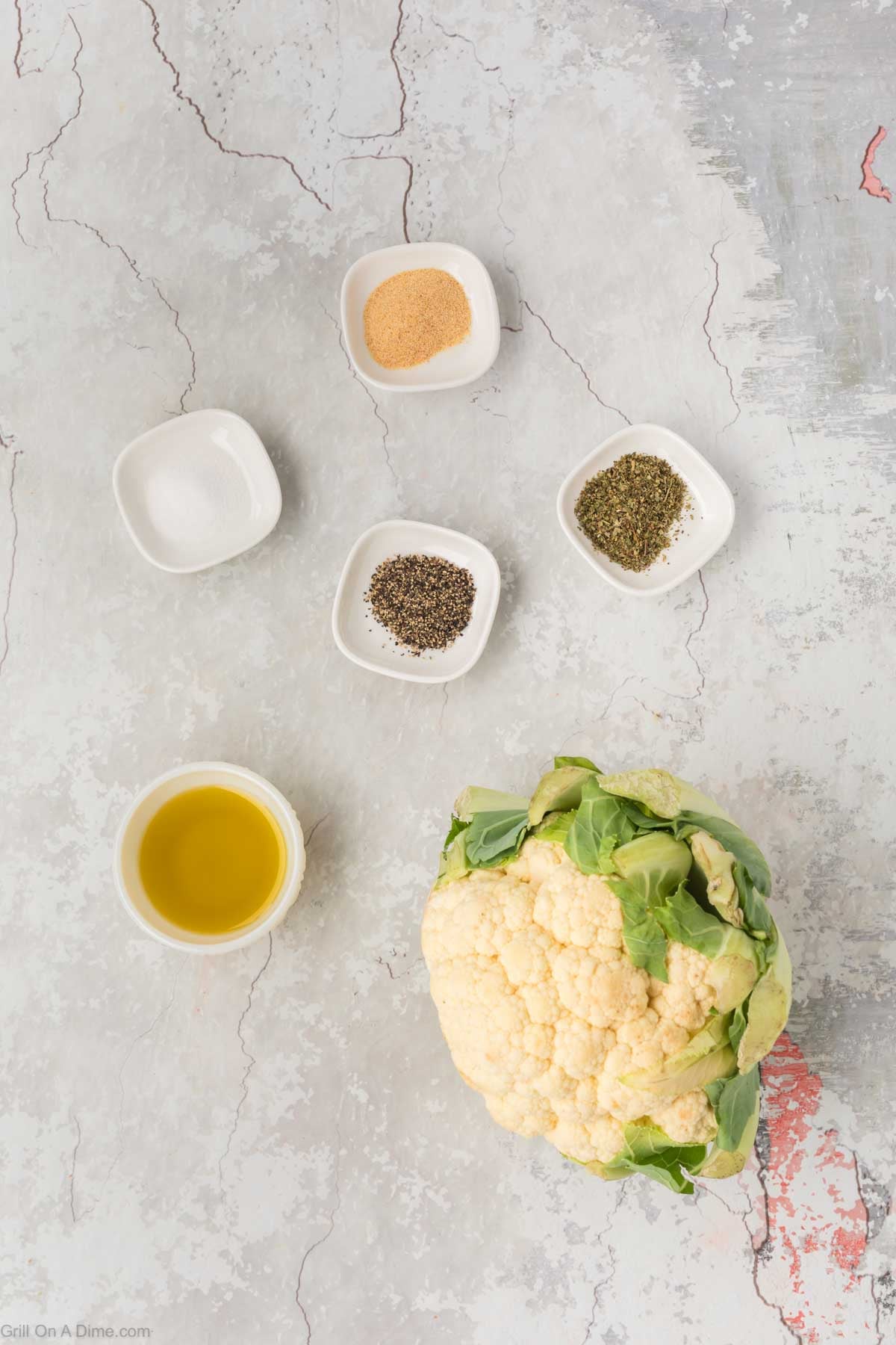 Cauliflower, oil, salt, pepper, Italian Seasoning and garlic powder