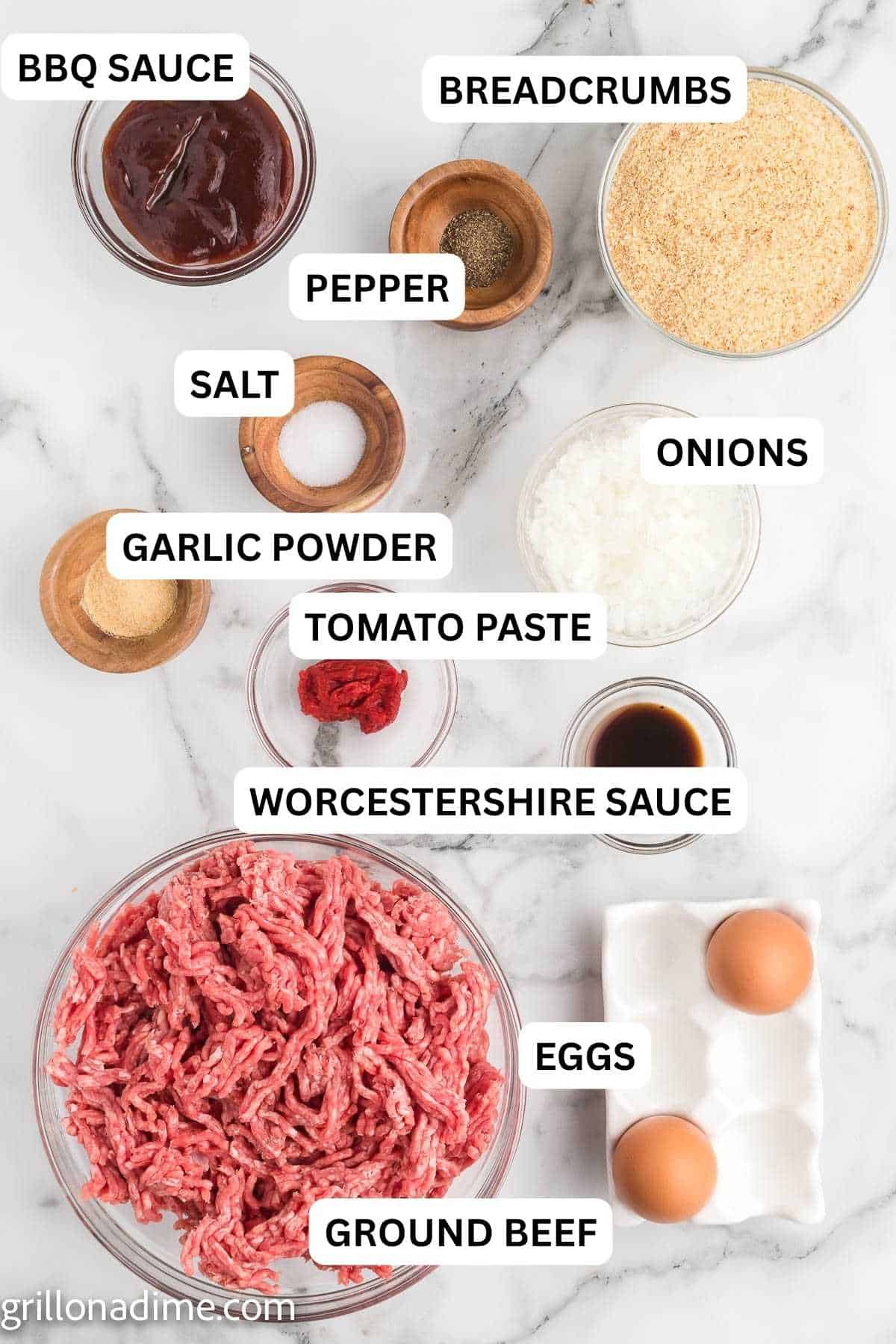 Smoked meatloaf ingredients - ground beef, eggs, breadcrumbs, onions, tomato paste, garlic powder, salt, pepper, worcestershire sauce, BBQ Sauce.