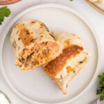 Mexican chicken burrito on a plate.