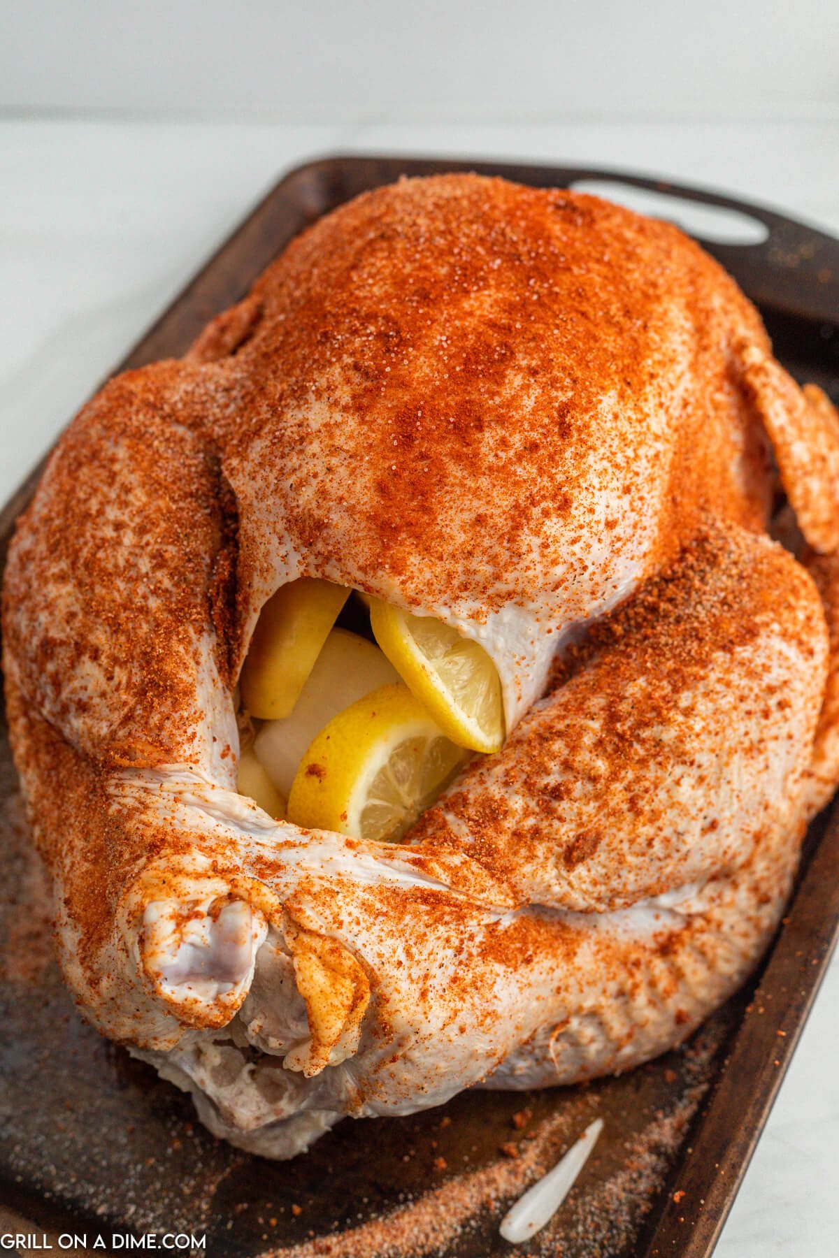 Seasoned Whole Turkey on a baking sheet