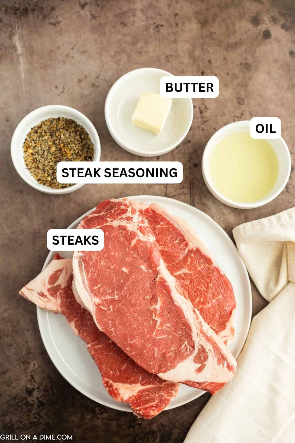 Ingredients needed to make this recipe which includes steaks, seasoning, oil, and butter.