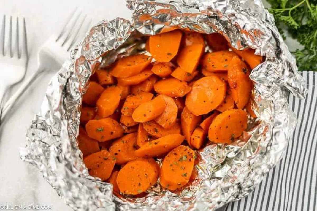 Sliced grilled carrots in foil.