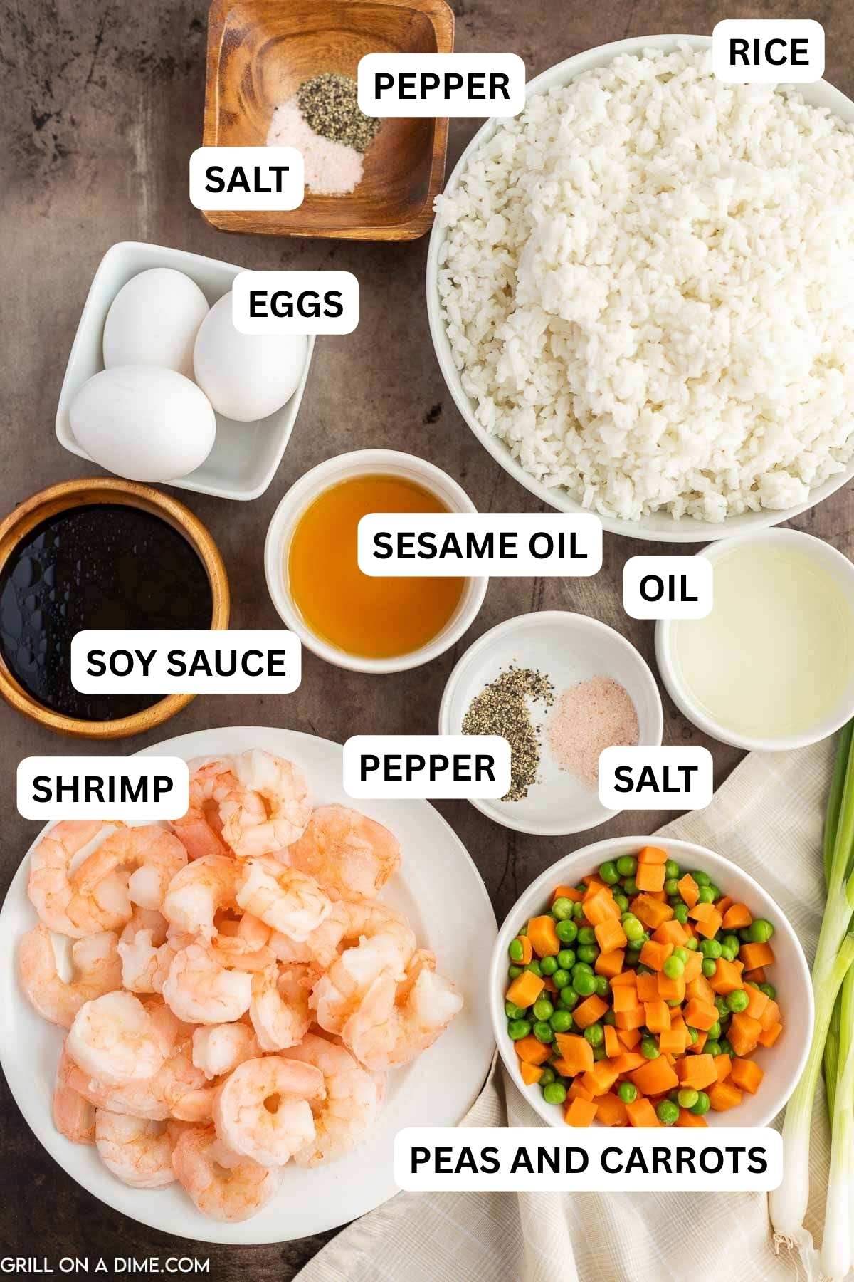 Ingredients needed to make this recipe which includes  shrimp, sesame oil, vegetable oil, cooked rice, soy sauce, salt and pepper, frozen peas and carrots, and eggs.
