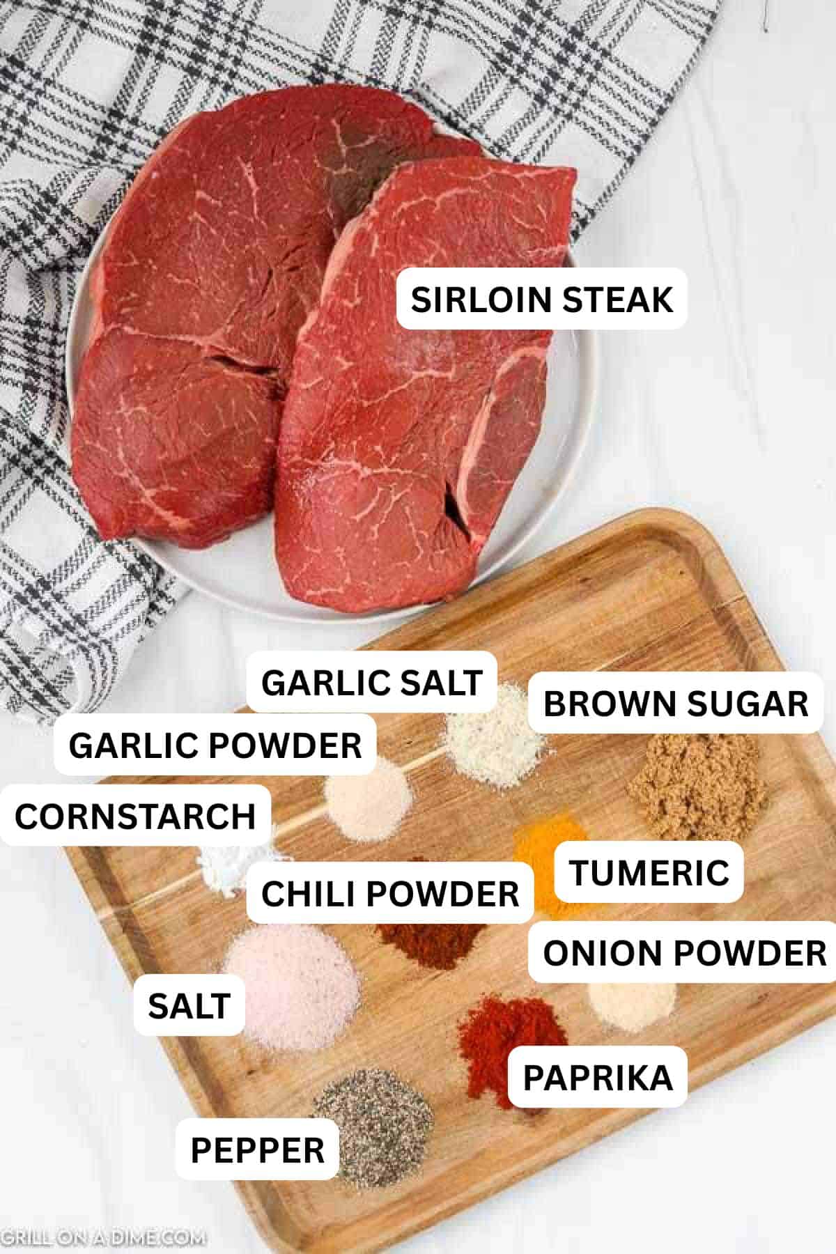 Ingredients need to make this recipe which include sirloin steaks and a wooden platter of spices. 