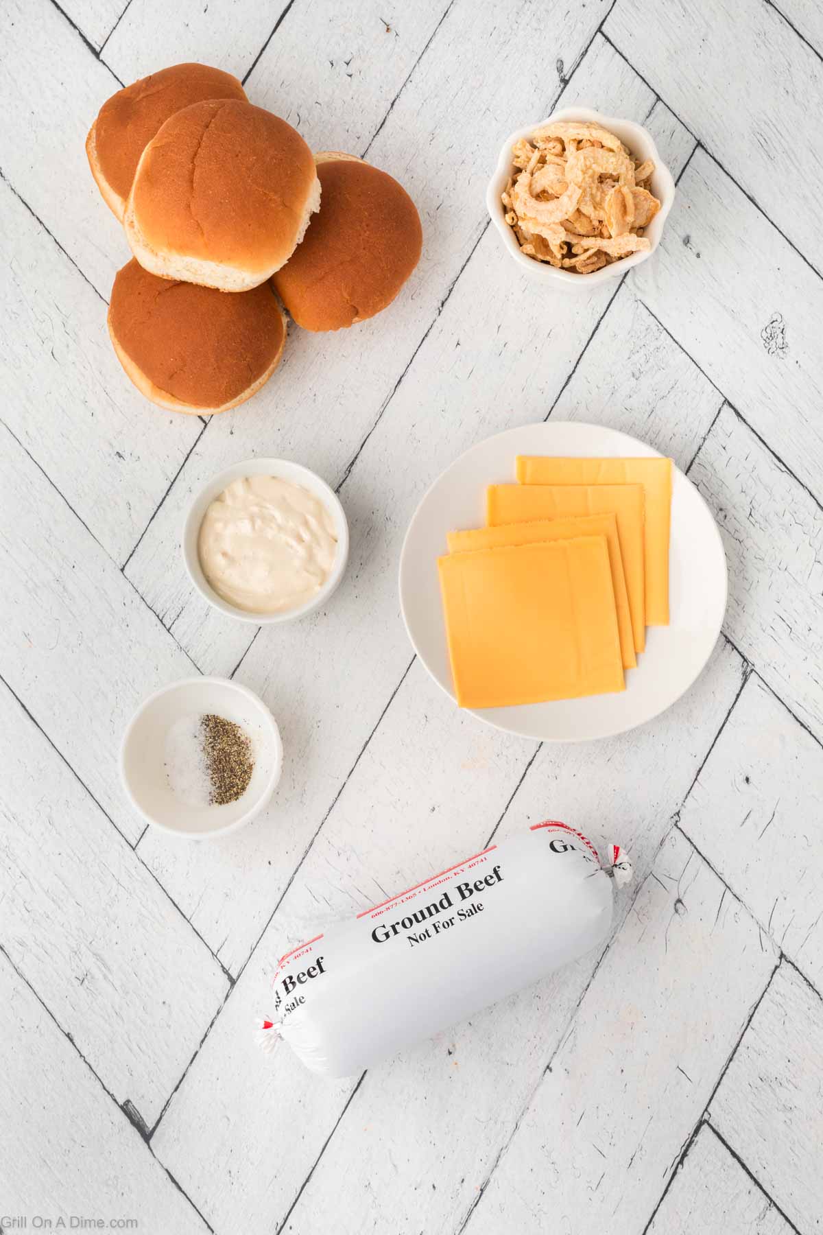 Ingredients - ground beef, slice cheese, salt, pepper, mayo burger buns, crispy onion rings