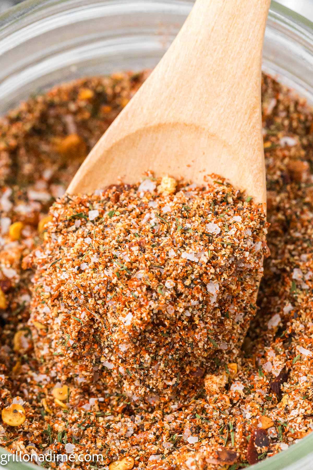 Montreal Steak seasoning in a jar with a serving on a teaspoon