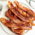 Cooked bacon on a plate.