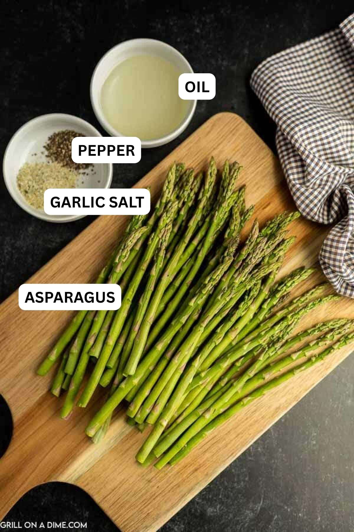 Ingredients needed to make this recipe which includes asparagus, oil, garlic salt, and black pepper.