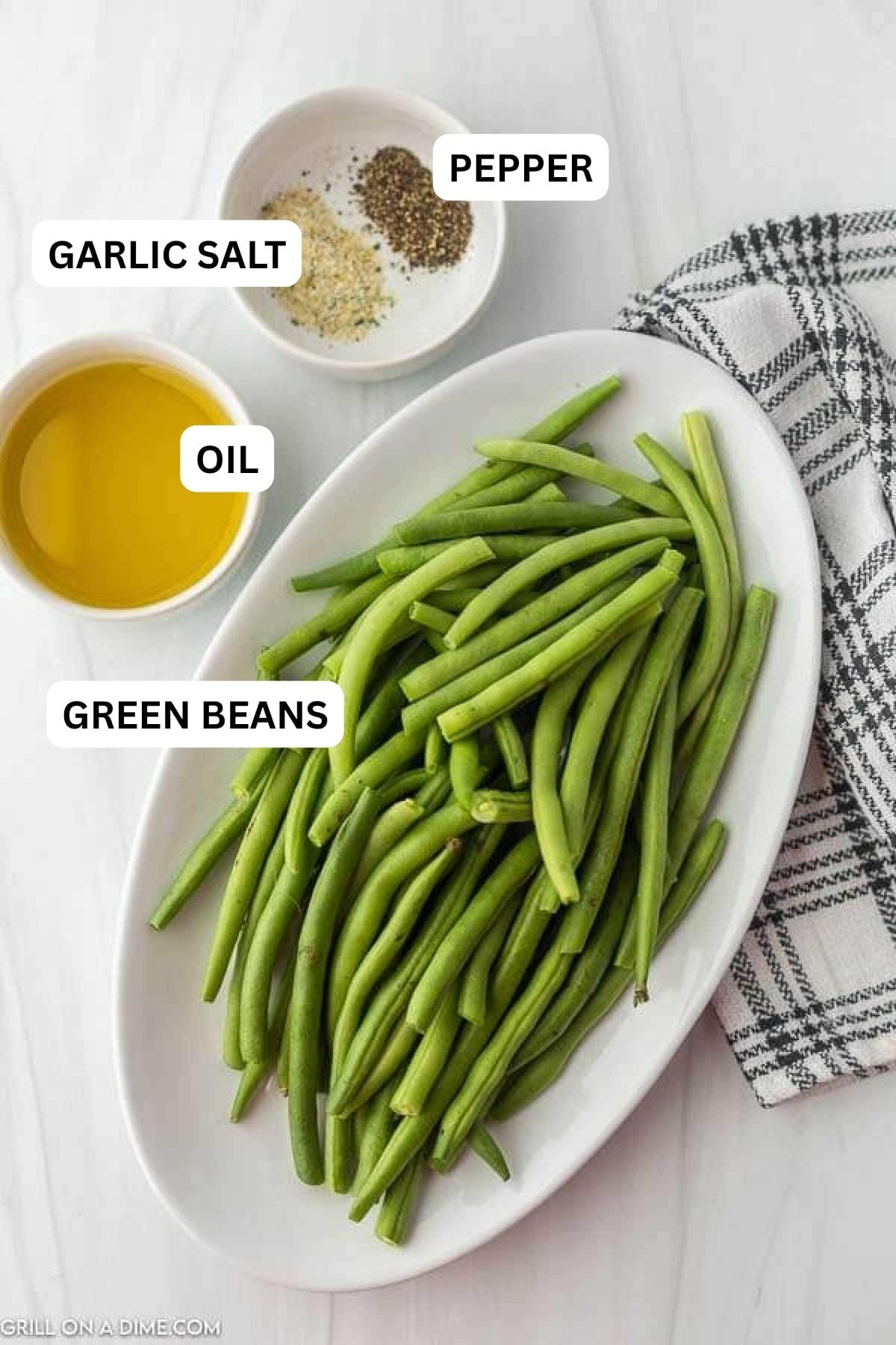 Ingredients needed to make this recipe which includes green beans, avocado oil, garlic salt and pepper.