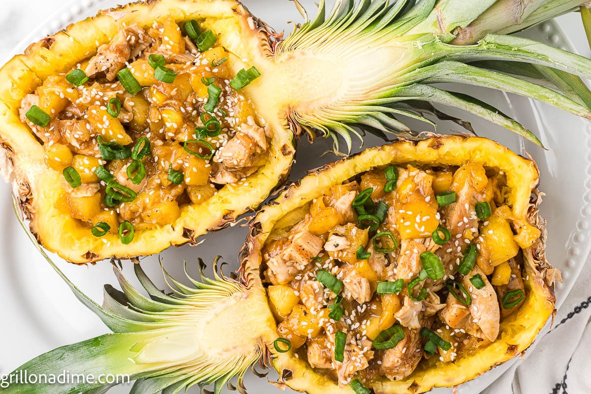 Pineapple Chicken in the hollow part of a whole pineapple