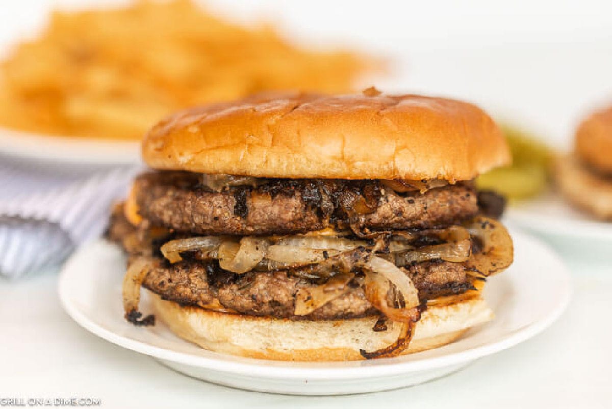 Close up of Oklahoma onion fried onion burger on a plate
