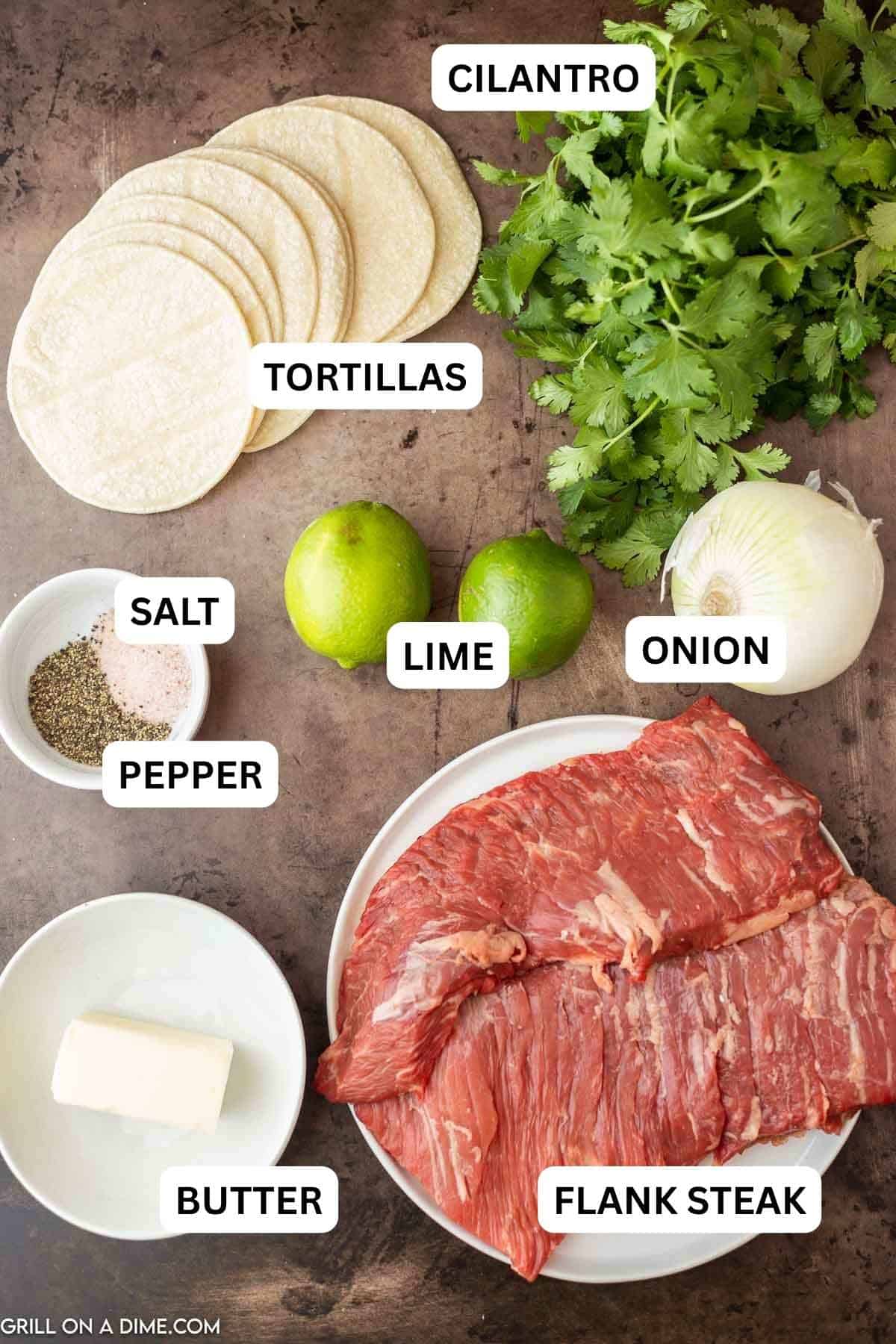 Ingredients needed to make this recipe which includes flank steak, vegetable oil, salt and pepper, fresh limes, butter, corn tortillas, onion, and cilantro.