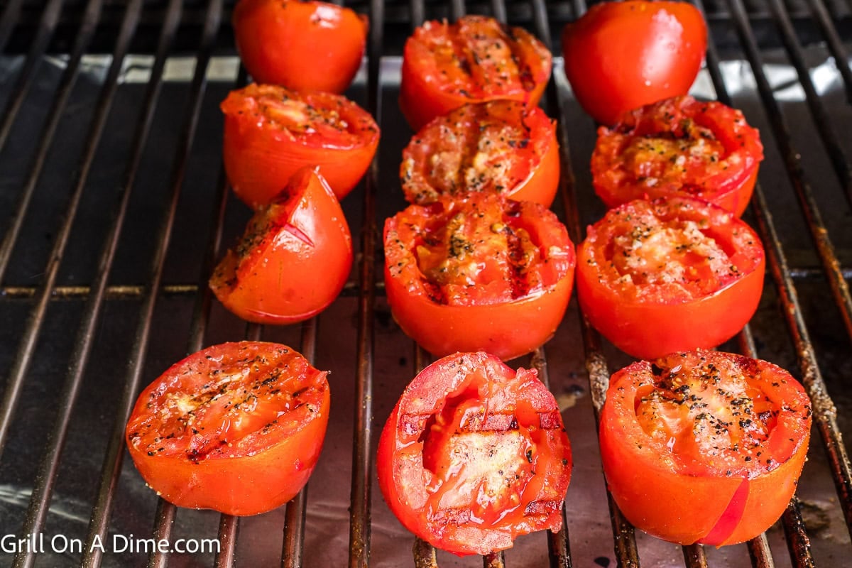 Grilled tomatoes on the grill grates