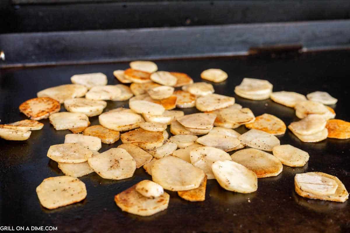 Fried Potatoes on a griddle.