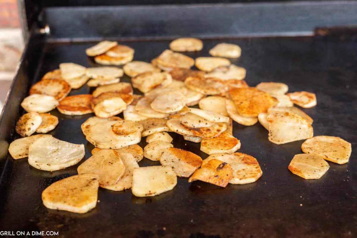 Fried potatoes on a griddle.
