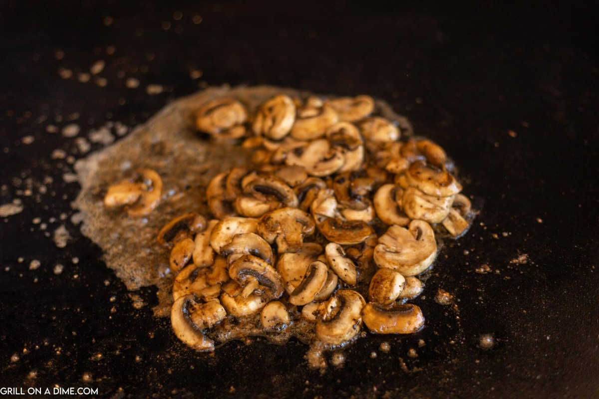 Cooking mushrooms on the griddle.