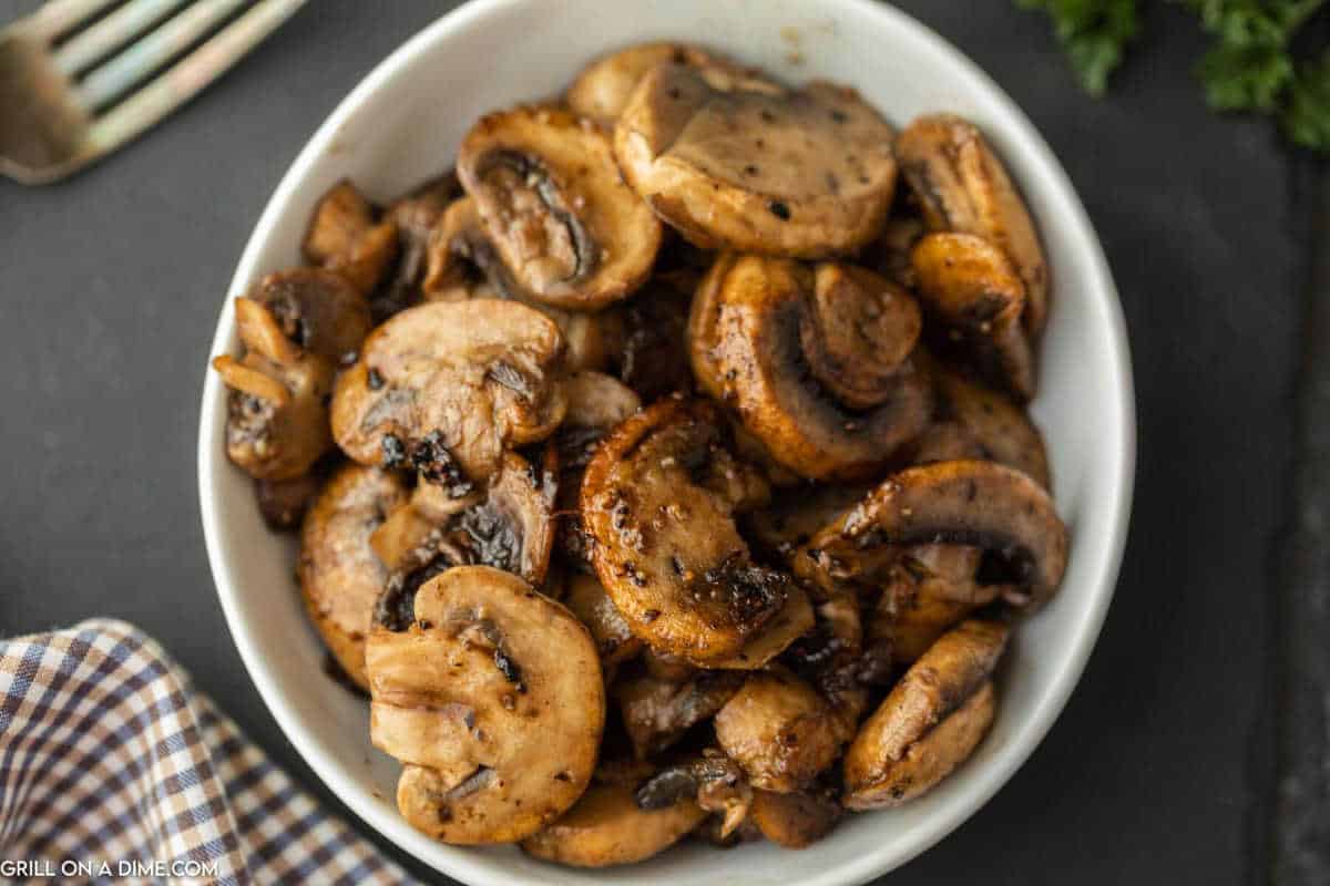Sauteed Mushrooms in a white bowl.