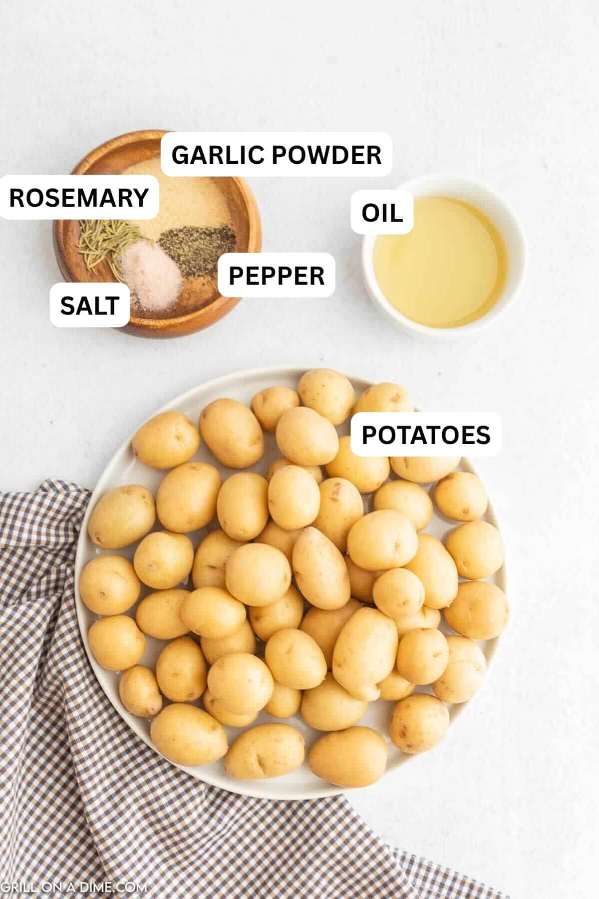 Ingredients needed to make this recipe which includes small potatoes, avocado oil, garlic powder, rosemary, salt and pepper.