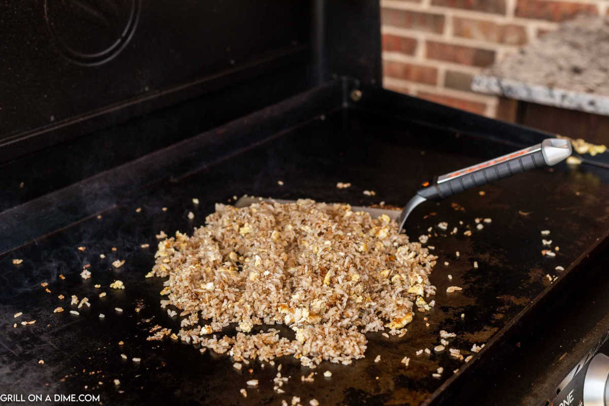 Cooking fried rice on the griddle.