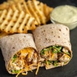 Chicken and cheese wrap with fries.