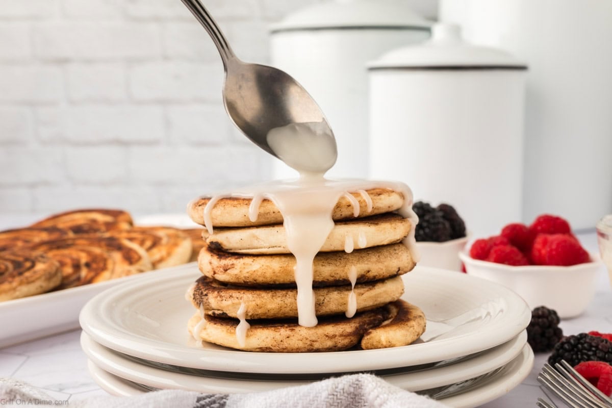 Cinnamon Rolls stacked and topped with icing