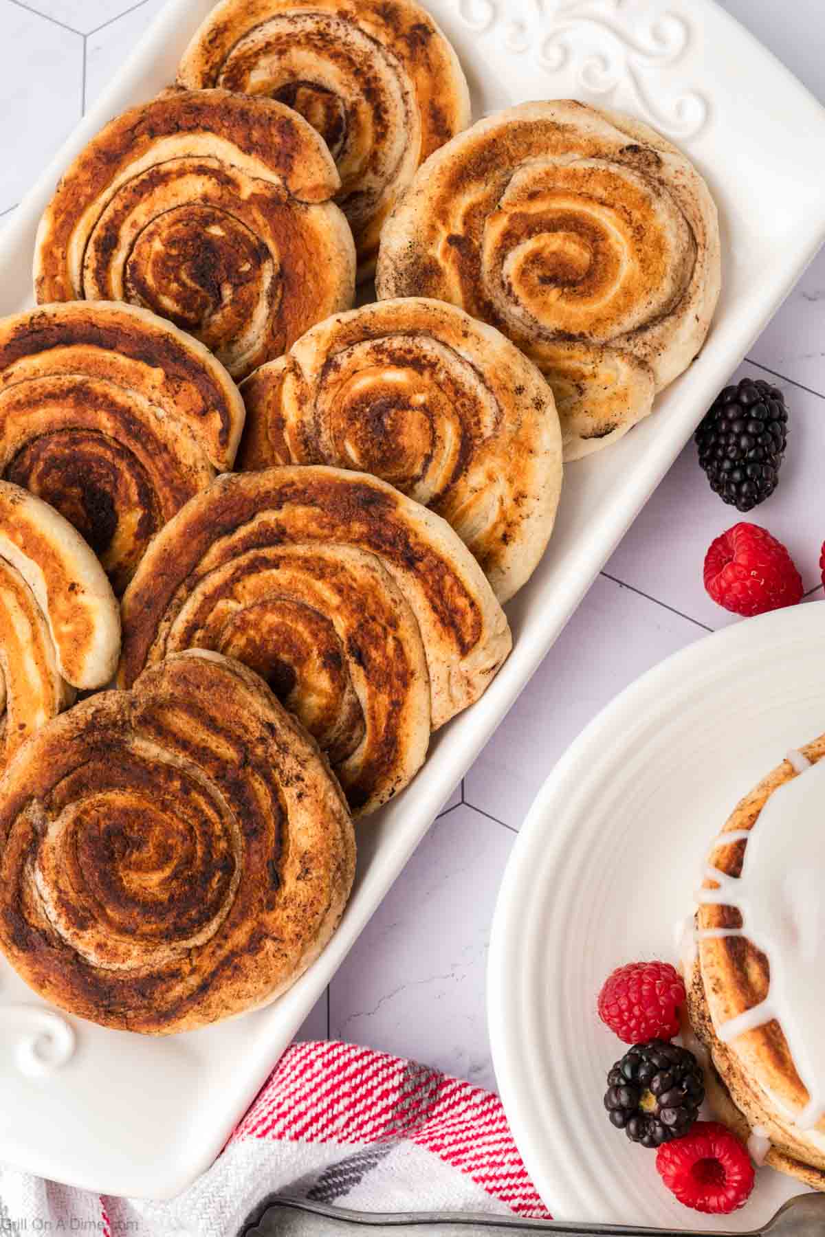 Cinnamon rolls on a white platter